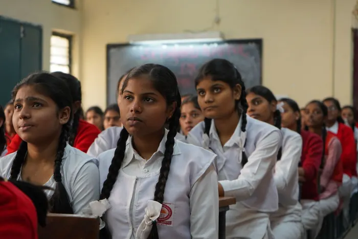 Schoolgirls listening in class